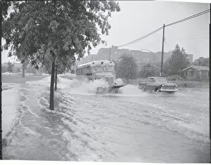 Bayside Prints: Bus and Car Driving Through Flooded Street