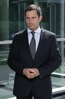 Suit Prints: Business man outside a bank building