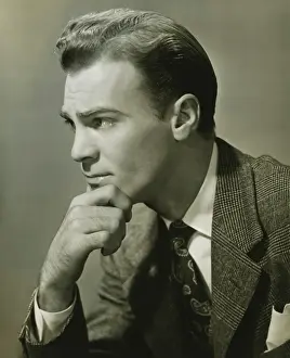 Introspection Prints: Businessman with pensive expression, (B&W), close-up