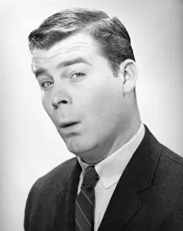 Businessman with quizzical expression