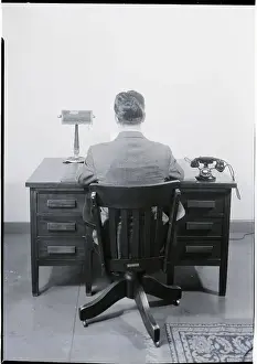 Businessman Sitting at a Desk