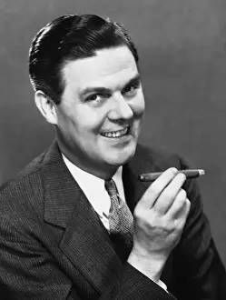 Businessman smoking cigar