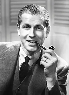Businessman smoking a pipe