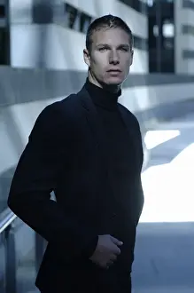 20 30 Prints: Businessman wearing a dark suit, standing in front of a modern bank building