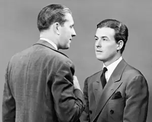 Only Mid Adult Men Prints: Two businessmen discussing in studio (B&W)