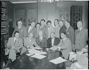 Businessmen Signing an Agreement