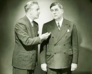 50 59 Years Prints: Two businessmen talking in studio, (B&W)