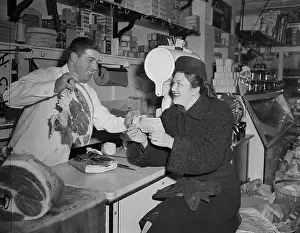 Butcher Prints: Butcher Shows Woman Large Steak
