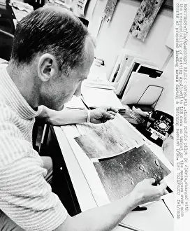 Buzz Aldrin Examining Lunar Shots at Kennedy Space Center