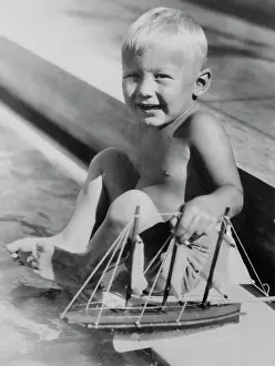 Buzz Aldrin Playing with Toy Boat