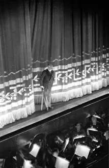 Prints of 20th July 1946: Director C B Cochran taking a bow after a performance of his musical Big Ben at the Adelphi Theatre. Original Publication: Picture Post - 4122 - Two Old Hands Put On A New Show - pub A Glimpse into the Past: C B Takes A Bow