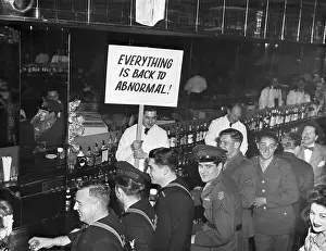 Cafe Zanzibar, Man Holds Up Sign