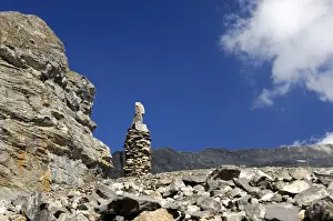 Sign Post Prints: Cairn as signpost and orientation help in rocky alpine terrain without trails