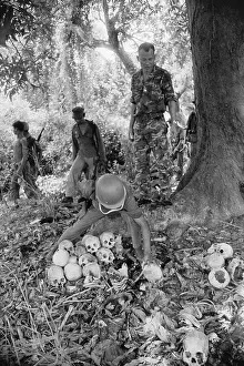 Cambodian Soldiers Examining Remains