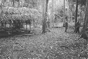 Cambodian Troops Inspecting a Camp