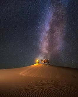 Star Collection: Camel herder under beautiful milky way in Mongolian Gobi desert