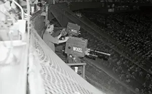 Cameraman Positioning Himself at Stadium