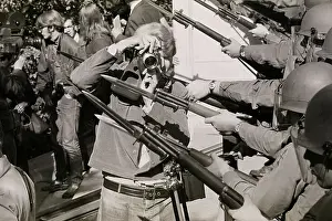 Cameraman Standing Between National Guard Bayonets