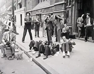 Cameramen On Backs On Sidewalk; Suicide