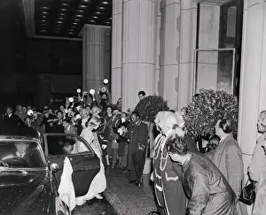 Cameramen Photographing a Guest Entering a Club
