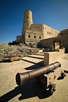 Images Dated 22nd January 2016: Canons guard the entrance to Bahla Fort, a UNESCO World Heritage Site in Northern Oman