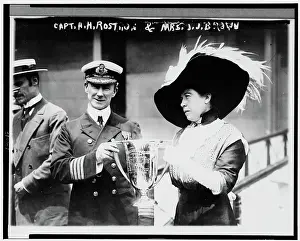 Prints of British merchant seaman Sir Arthur Henry Rostron (1869 - 1940) (center), captain of the RMS Carpathia, is presented with a trophy cup by American socialite Molly Brown (1867 - 1932), New York A Visual Journey Through the Legacy of the World’s Most Infamous Ship: Captain Rostron Received Trophy From Molly Brown