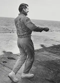 Walter M Prints: Captain Walter M. Schirra Exercising on Deck