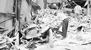 Flood Prints: Car Buried Under Pile Of Bricks