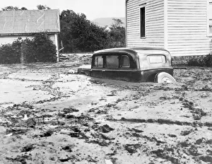Flood Prints: Car Covered by Mud from the Mississippi