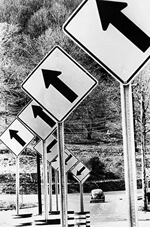 Confusion Prints: Car Driving By Up & Down Arrow Road Signs