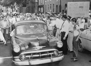 Desegregation Prints: Car Escorting African American Students