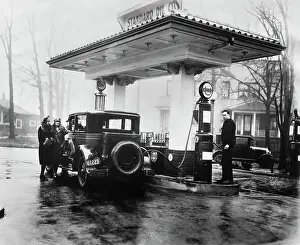 Car Fueling Up at Gas Station