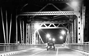 Lac0049 Prints: Car At Night Driving Across Bridge