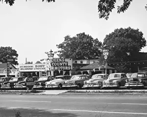 Parked Prints: Car parked in used car lot, (B&W), low section