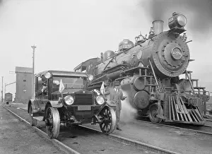 Car Preparing to Race Train