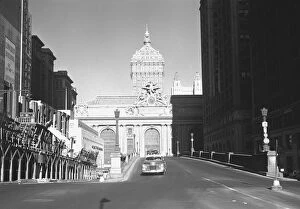 Car riding on street, Grand Central Station in background, New York City, USA, (B&W)