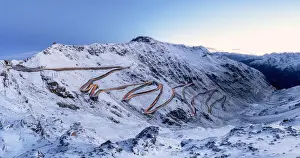 Stelvio Pass, Stelvio, Italy Prints: Car trails lights on bends of Stelvio Pass mountain road, South Tyrol, Italy