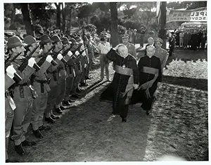 Cardinal Walking Past Guards