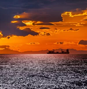 Images Dated 19th June 2013: Cargo ship at sunset