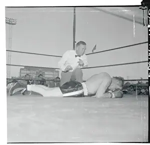 Carl Olson Lying on the Ring's Canvas