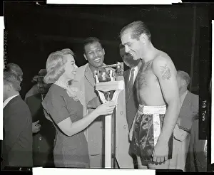 Carl Olson Being Weighed by Joyce Brothers