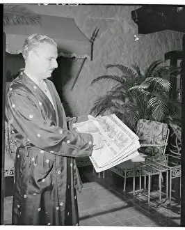 Carlos Prio Socarras Pointing to Newspaper