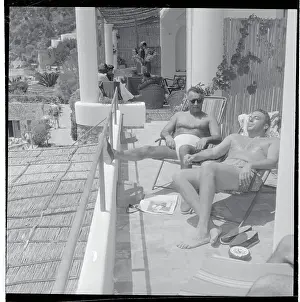 Capri Prints: Carmine De Sapio and Fortune Pope Relaxing on Lounge Chairs