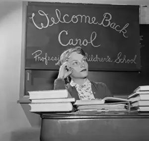 Carol Heiss Sitting at Desk With Books