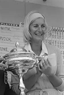 Carol Mann Holding Her Trophy