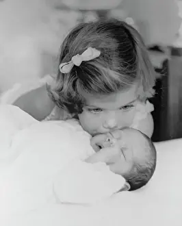 Caroline Kennedy Kissing Newborn JFK Jr