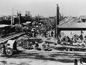 Town Scene Prints: Carriages Traveling Along Main Street in Peking