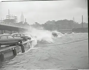 Cars Sprayed by River Waves
