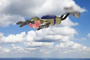 Figurine Prints: Cartoon character BASE jumper in gliding flight through clouds