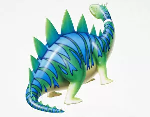 Spiked Gallery: Cartoon character depiction of green dinosaur with blue stripy skin and spikes, side view